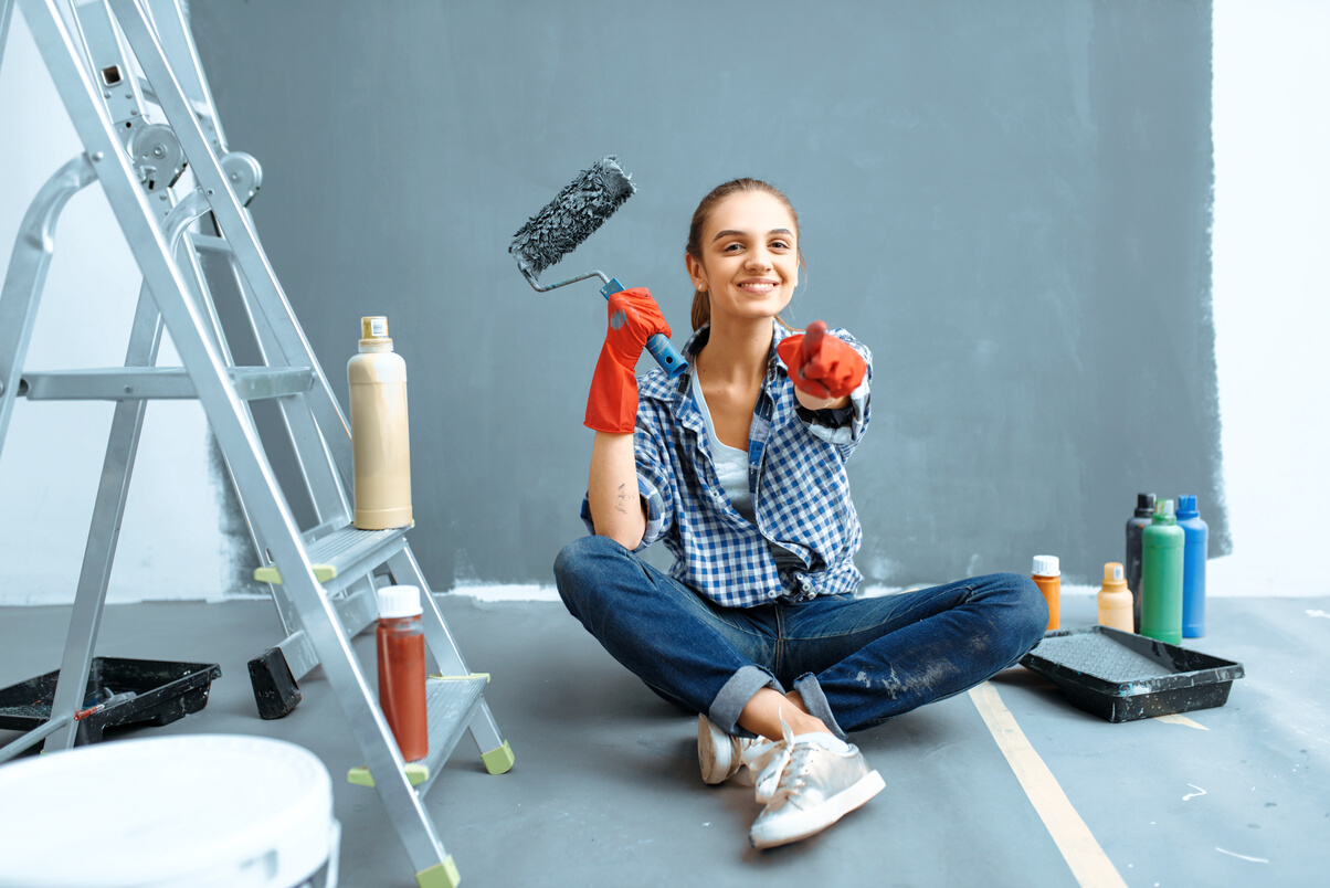 Smiling Female House Painter after Home Repair
